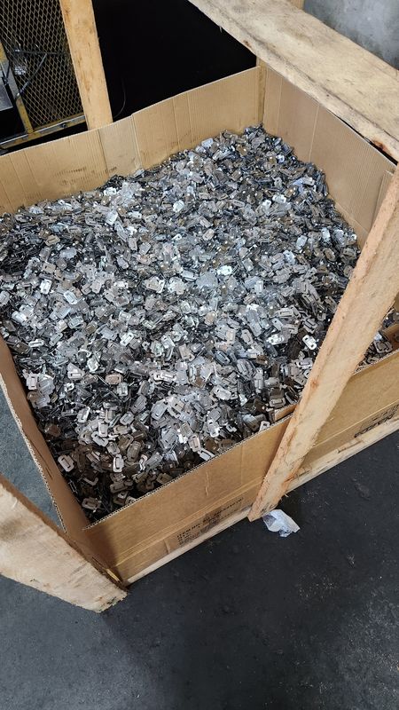Crate holding a lot of 10,000 stamped buckles